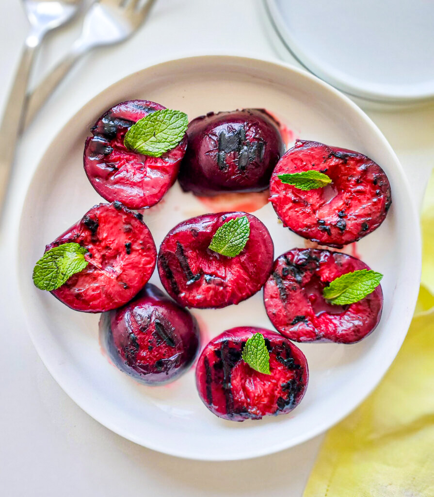 Grilled plums on a plate